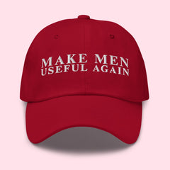 red political hat that says make men useful again in white embroidery- shop feminist trash for feminist hats and political clothing