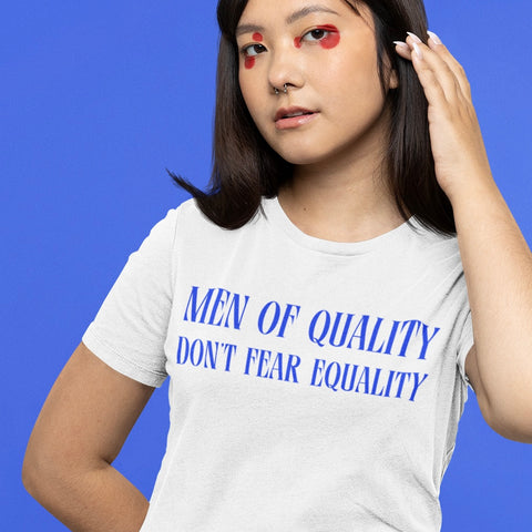 white feminist tshirt that says men of quality don't fear equality in bold blue writing- shop feminist trash for feminist shirts and political clothing
