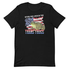 Front view of the black Nothing More American Than Trans Frogs Shirt isolated on a crisp white background. The satirical queer graphic tee displays a bold green frog on a deep fried patriotic flag layout.