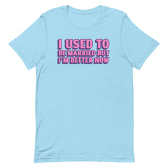ocean  blue feminist t-shirt that says i used to be married but i'm better now in bold pink and purple font- shop our collection of dump him shirts