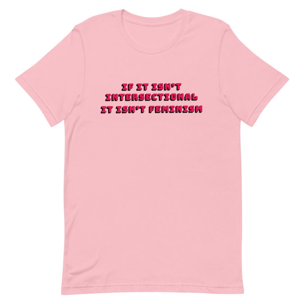 Pink feminist t-shirt with 'If It Isn’t Intersectional It Isn’t Feminism' text in red, promoting an inclusive message of empowerment and equality. Shop feminist t-shirts