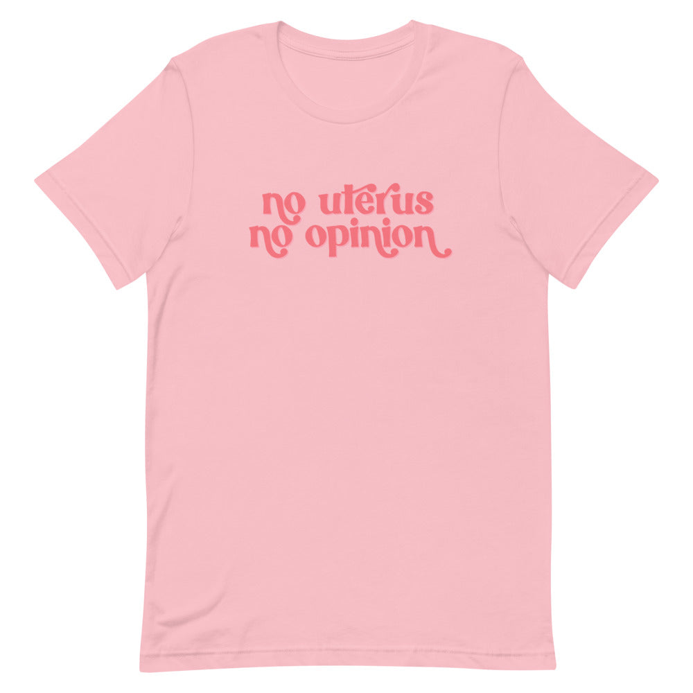 Pink feminist t-shirt with 'No Uterus No Opinion' text in peach, promoting reproductive choice and gender equality. Shop feminist t shirts