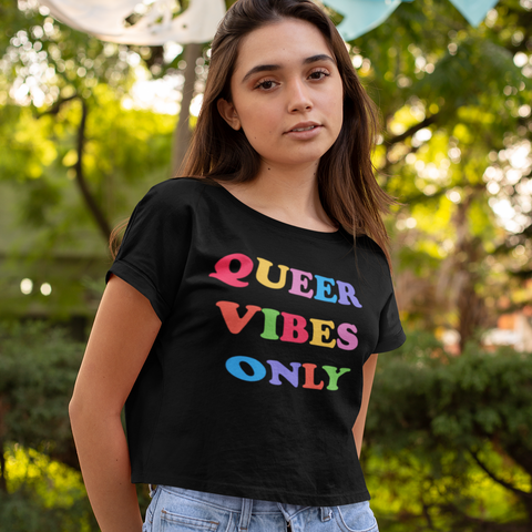 Black allover print pride crop top that says queer vibes only in rainbow writing. Grab your pride themed shirts today! Check out more pride clothes from our pride collection! Shop Feminist Trash for social justice clothing