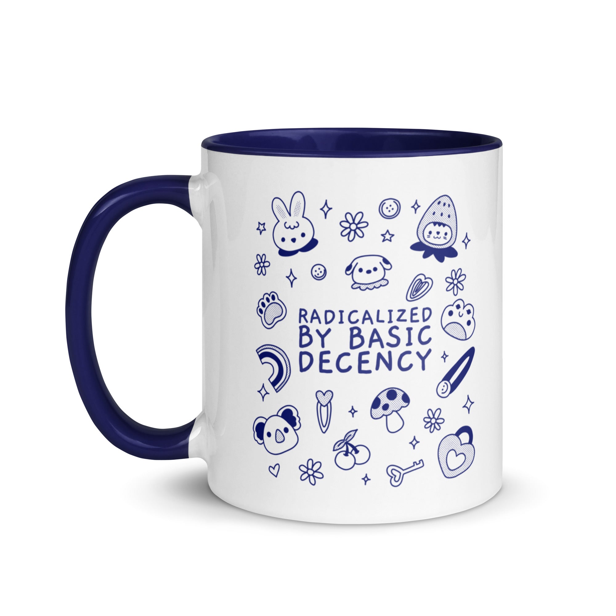 A high-quality ceramic coffee mug featuring the text "Radicalized by Basic Decency" in bold typography. The mug features a contrasting colorful handle and interior, displayed against a clean white background.