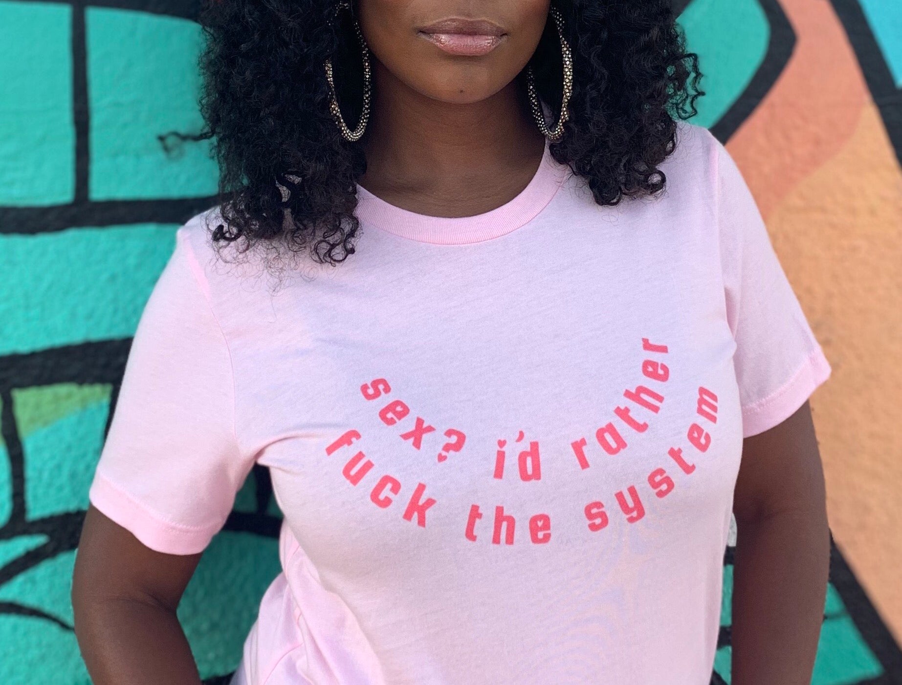 Women's rights t shirt in pink proclaiming "Sex? I'd Rather Fuck The System" in red writing