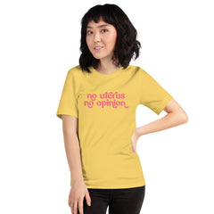 Yellow feminist t-shirt with 'No Uterus No Opinion' text in peach, asserting reproductive rights and gender equality. Shop feminist apparel
