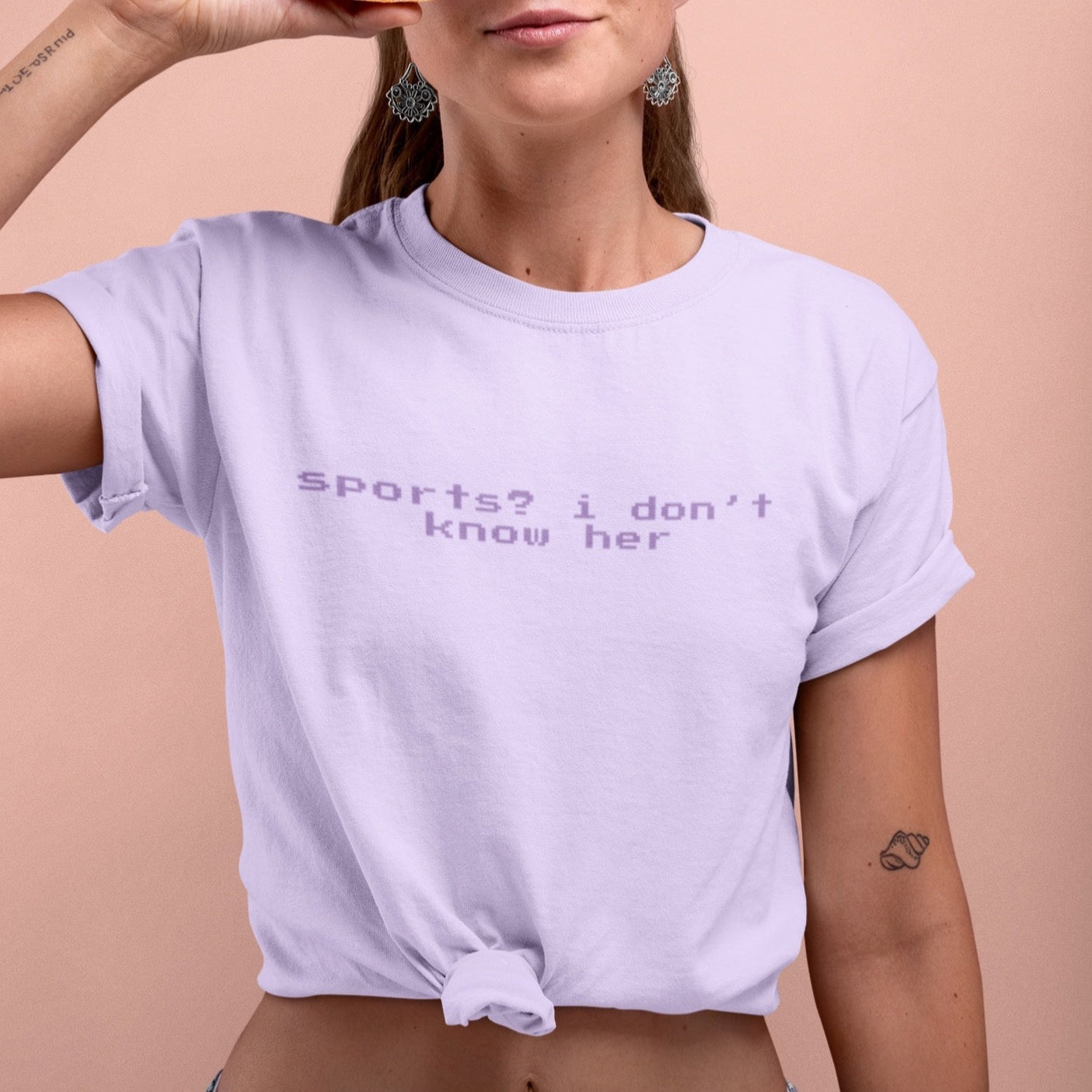Sports? I Don’t Know Her Short-Sleeve Unisex Feminist T-Shirt - Feminist Trash Store - Shop Women’s T-shirts - Oversized Women’s Shirt