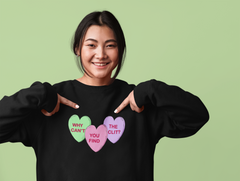 Why can’t you find the clit Unisex oversized black Feminist Sweatshirt featuring three candy hearts in the colours green, pink and purple- define feminism with our feminist apparel
