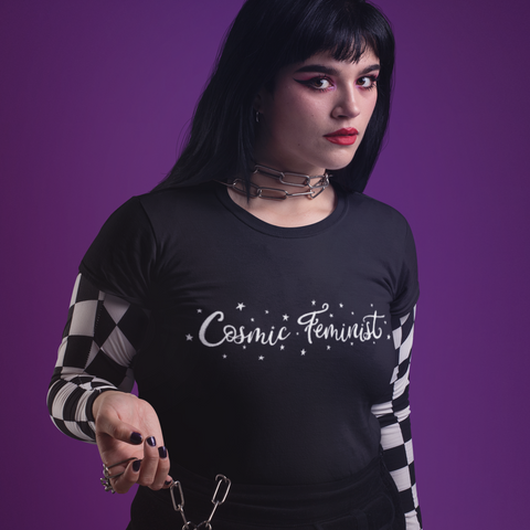 Black Feminist Tshirt that says Cosmic Feminist in white witchy writing surrounded by stars- Shop Feminist Trash for feminist tees, witchy outfits, political clothing, dump him shirts and outfits for pride.