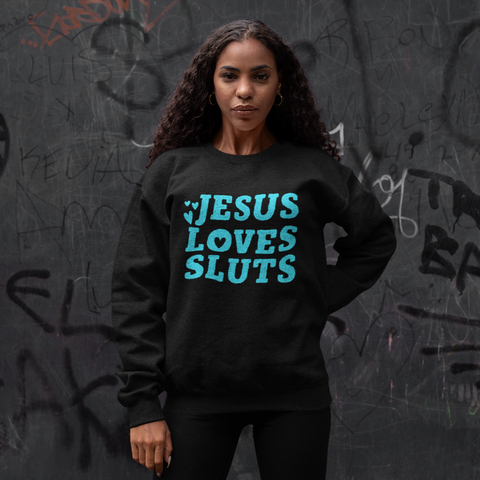 Black feminist sweatshirt that says Jesus Loves Sluts in blue bold hand lettered writing featuring heart illustrations. Shop Feminist Trash Store for feminist t shirts and political clothing.