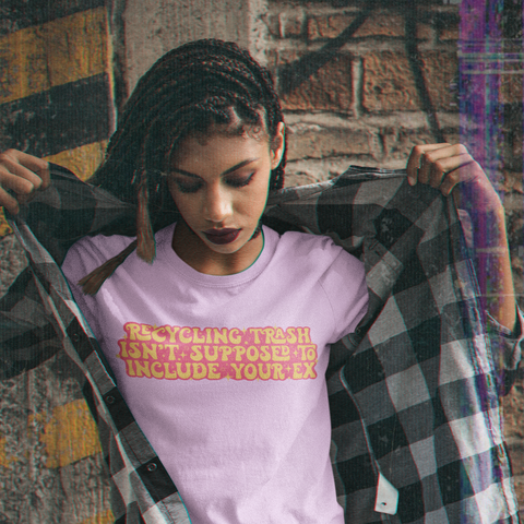 Feminist shirt that says Recycling Trash Isn’t Supposed To Include Your Ex in yellow and pink writing. Shop Women’s Rights T-shirts and Feminist Clothing