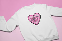 White feminist sweatshirt featuring a love heart illustration with the words dump him written in bubble writing- shop our dump him shirts