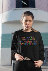 black feminist sweatshirt that says Mediocre White Men Should Be The Diversity Hire in rainbow writing- define feminism with our feminist apparel and dump him shirts