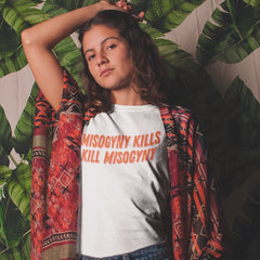 White Feminist T-shirt that says Misogyny Kills Kill Misogyny in orange writing- define feminism with our feminist shirts, dump him sweatshirts, clothing for gay women, witchy outfits and political tshirts