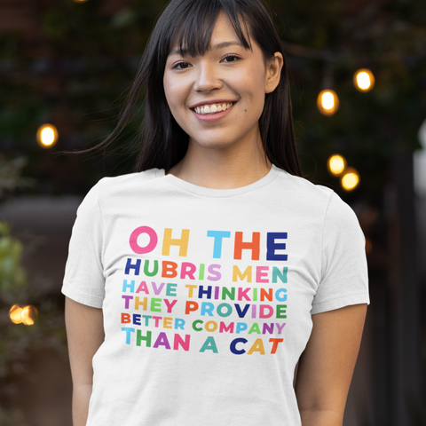 White feminist shirt that says oh the hubris men have thinking they provide better company than a cat in rainbow writing- shop feminist trash for funny t-shirts for women and feminist tees