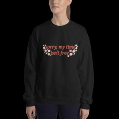black feminist sweatshirt that says sorry my time isn't free in orange writing surrounded by white and orange retro flowers- shop feminist shirts, political clothes and dump him shirts