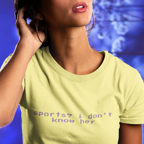 yellow feminist tee that says Sports? I Don’t Know Her her in purple retro glitch writing- shop feminist trash for political clothing, feminist tees and dump him shirts