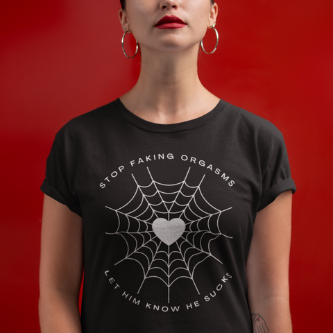 black feminist tee that says stop faking orgasms let him know he sucks in white writing featuring a heart spider web illustration- shop feminist trash for women's rights t-shirts and dump him shirts